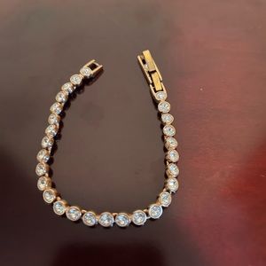 Authentic women’s Swarovski rose gold tennis bracelet like new!